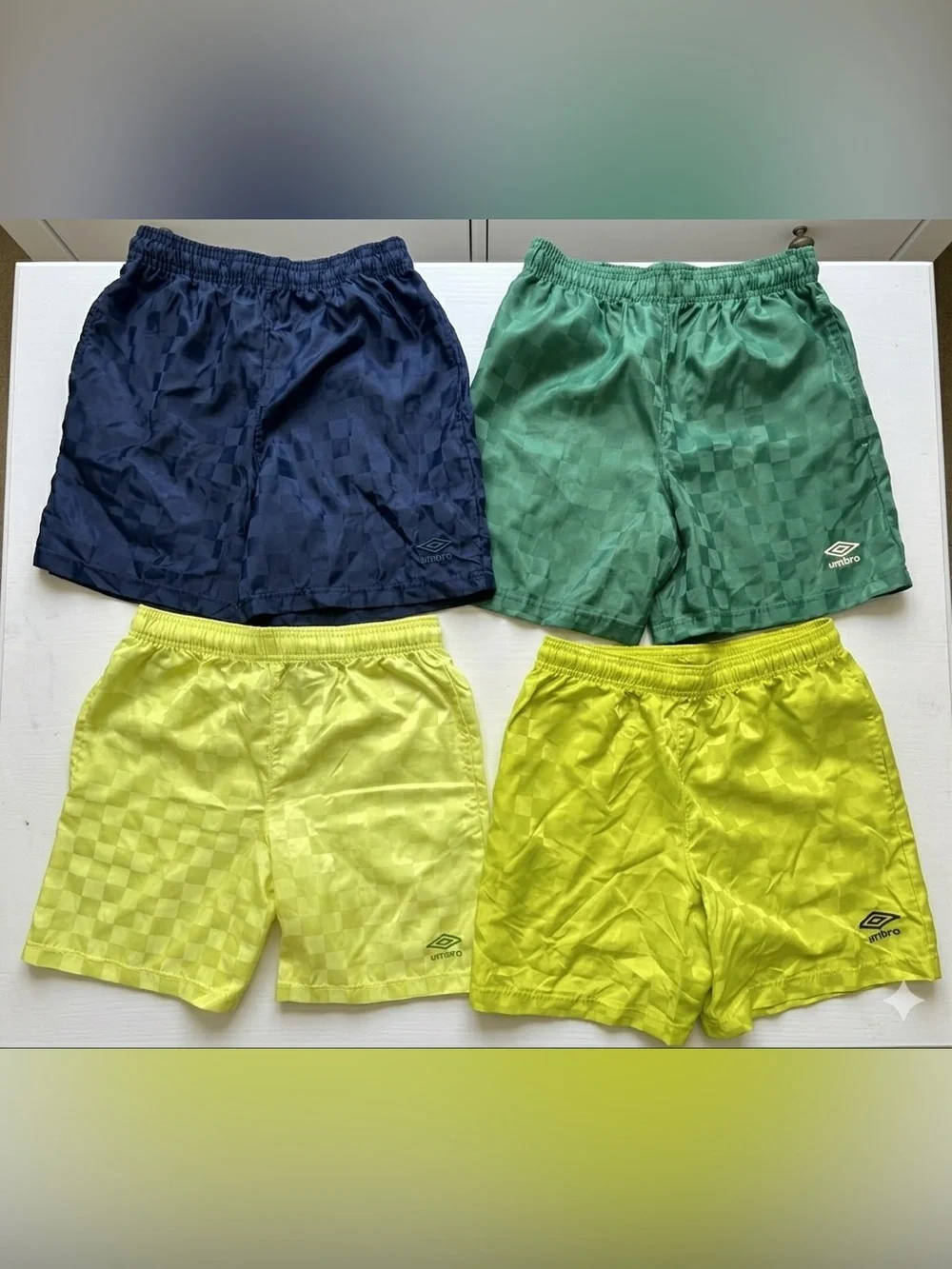 BUNDLE Of 4 / modern reissue checkered Umbro athletic shorts. Like new size L